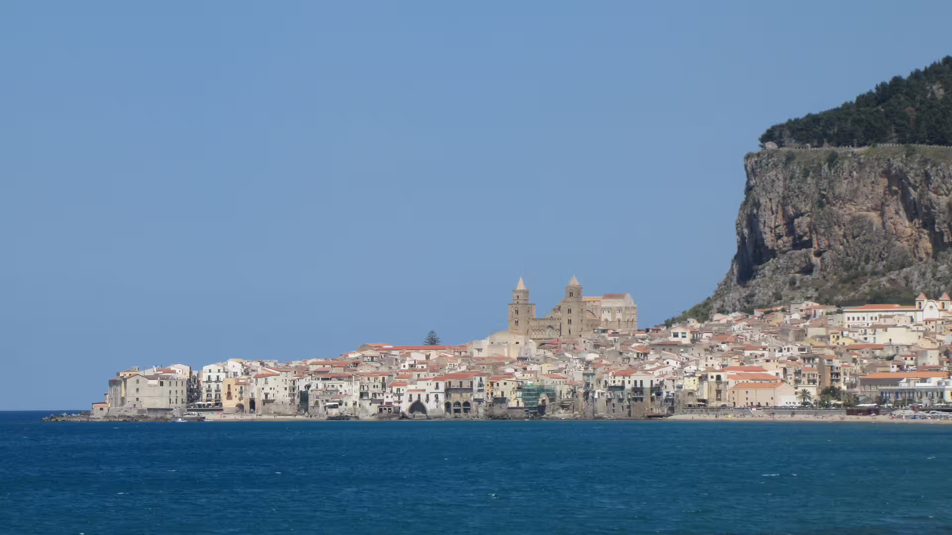 Panoramic view of Cefalù seaside town and La Rocca cliff, Sicily, on Cefalù and Castelbuono tour
