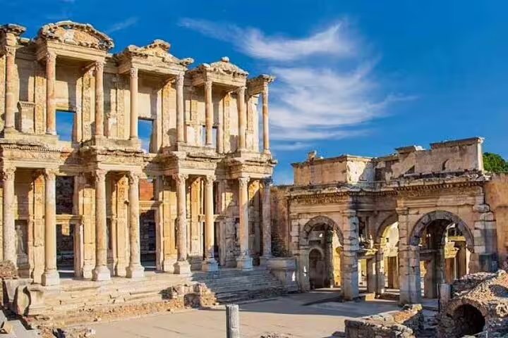Majestic ruins of Celsus Library in Ephesus under a clear blue sky, featured in the 4-day Revelation tour.