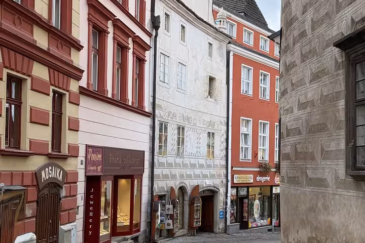 Colorful Cesky Krumlov old town buildings and shops on a private day tour from Vienna, Czech Republic
