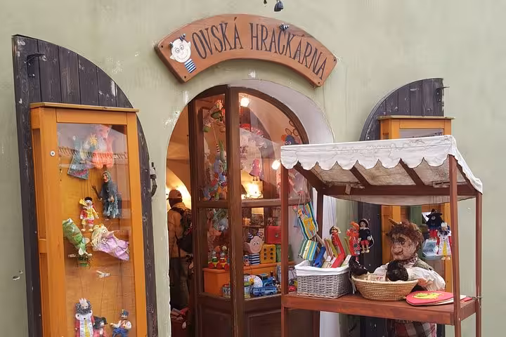 Traditional toy shop storefront in Cesky Krumlov old town, visited on a small-group day trip from Vienna