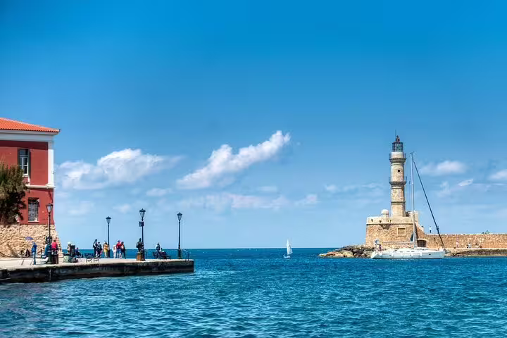 Discover the picturesque Chania harbor with its historic lighthouse on a private tour from Rethymno.