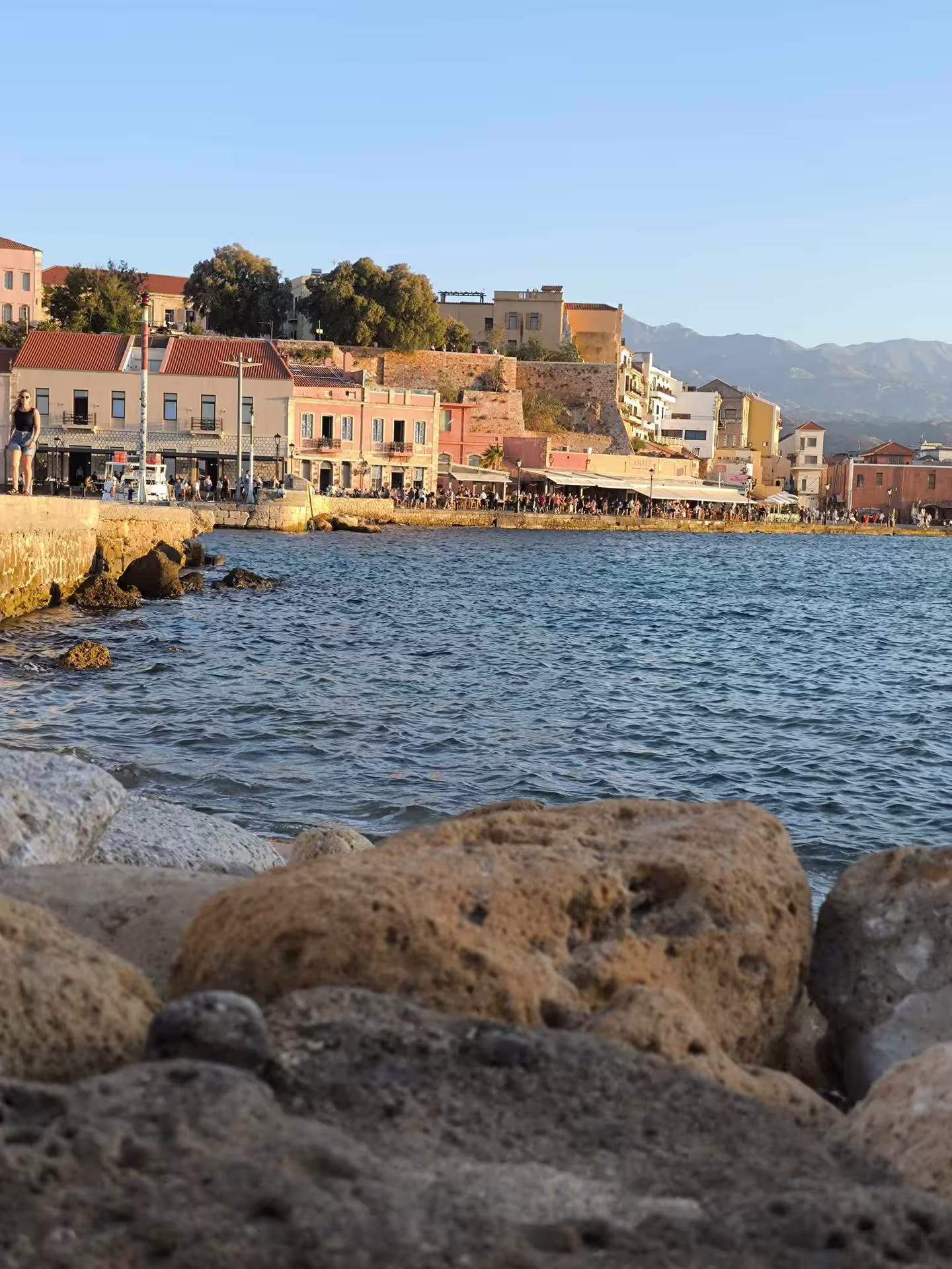 Chania's picturesque waterfront with historic buildings and serene sea views during the Explore Aptera tour.