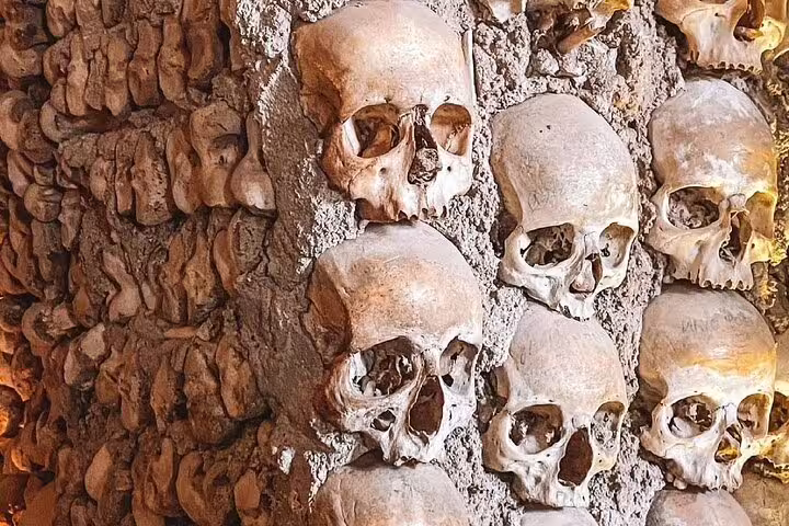 Chapel of Bones in Évora, Portugal, showcasing walls adorned with human skulls, a highlight of the Full-Day Évora Tour from Lisbon.
