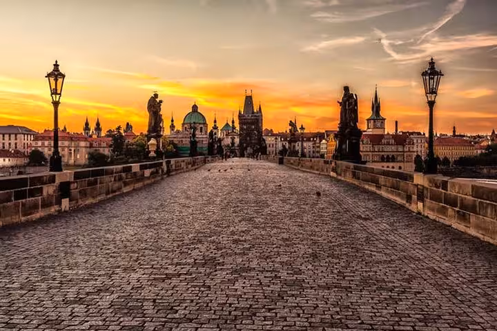 Sunrise on Charles Bridge in Prague, iconic stop on small-group day trip from Vienna to Czech Republic