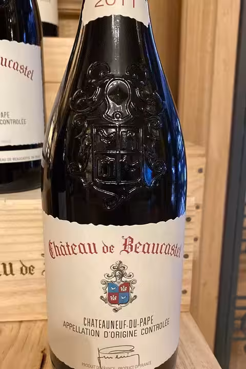 Close-up of Châteauneuf-du-Pape red wine bottle in cellar, featured on a full private day Avignon wine tasting tour