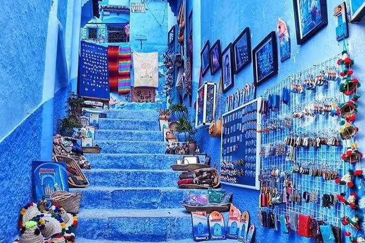 Blue alley steps in Chefchaouen medina with local crafts, Morocco best 8 days tour from Tangier