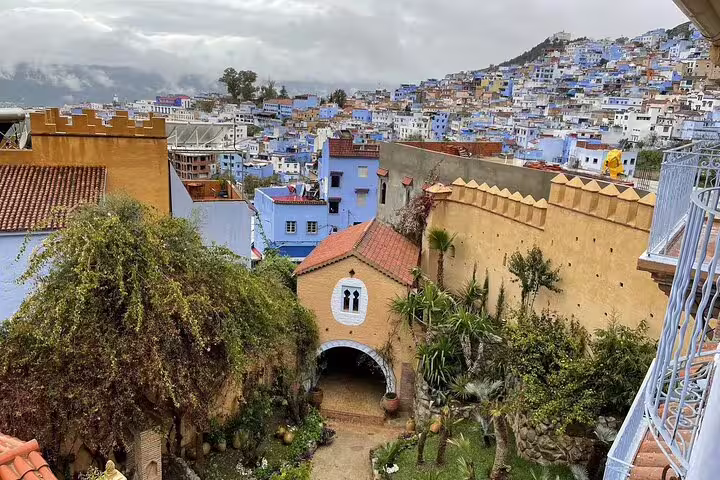 Chefchaouen blue city hillside view and medina courtyard, highlight on Morocco 11-day tour from Casablanca to Sahara