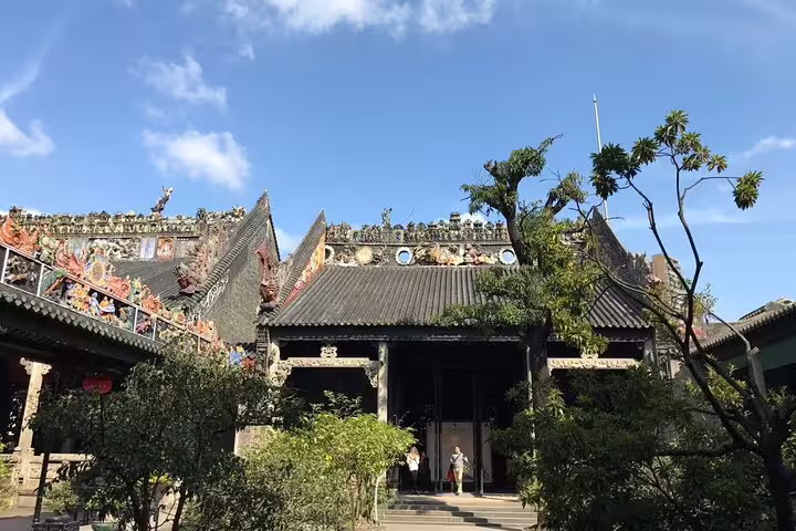 Historic Chen Clan Ancestral Hall in Guangzhou, showcasing intricate traditional architecture and lush gardens.