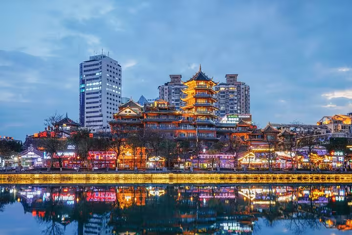 Vibrant skyline of Chengdu featuring traditional architecture and modern buildings, captured during a customized city tour.