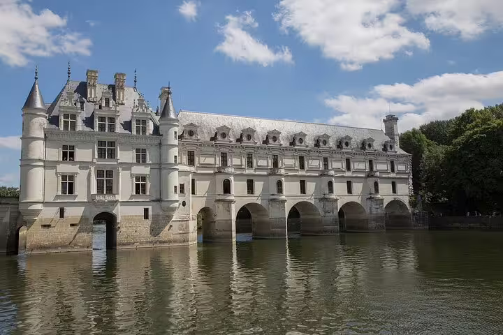 Château de Chenonceau over the Cher River, scenic stop on Versailles private two-way transfer from Paris