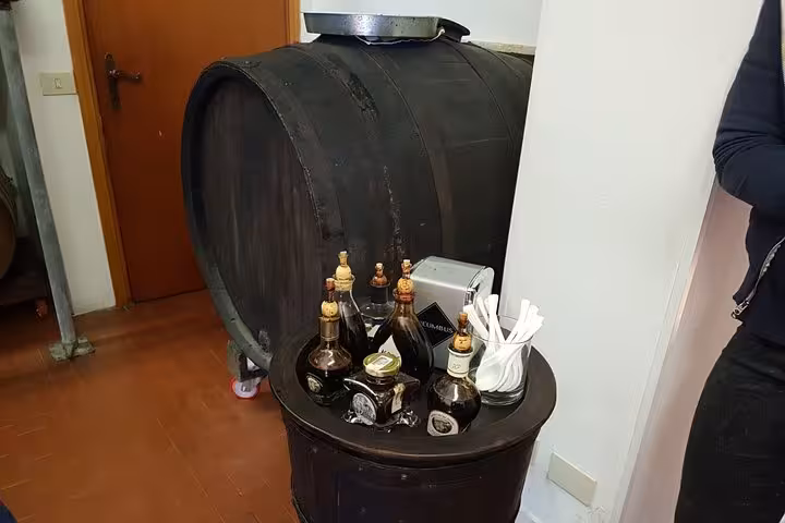 Wine cellar barrel and tasting bottles during Chianti wine tasting tour from Rome near Castellina, Tuscany