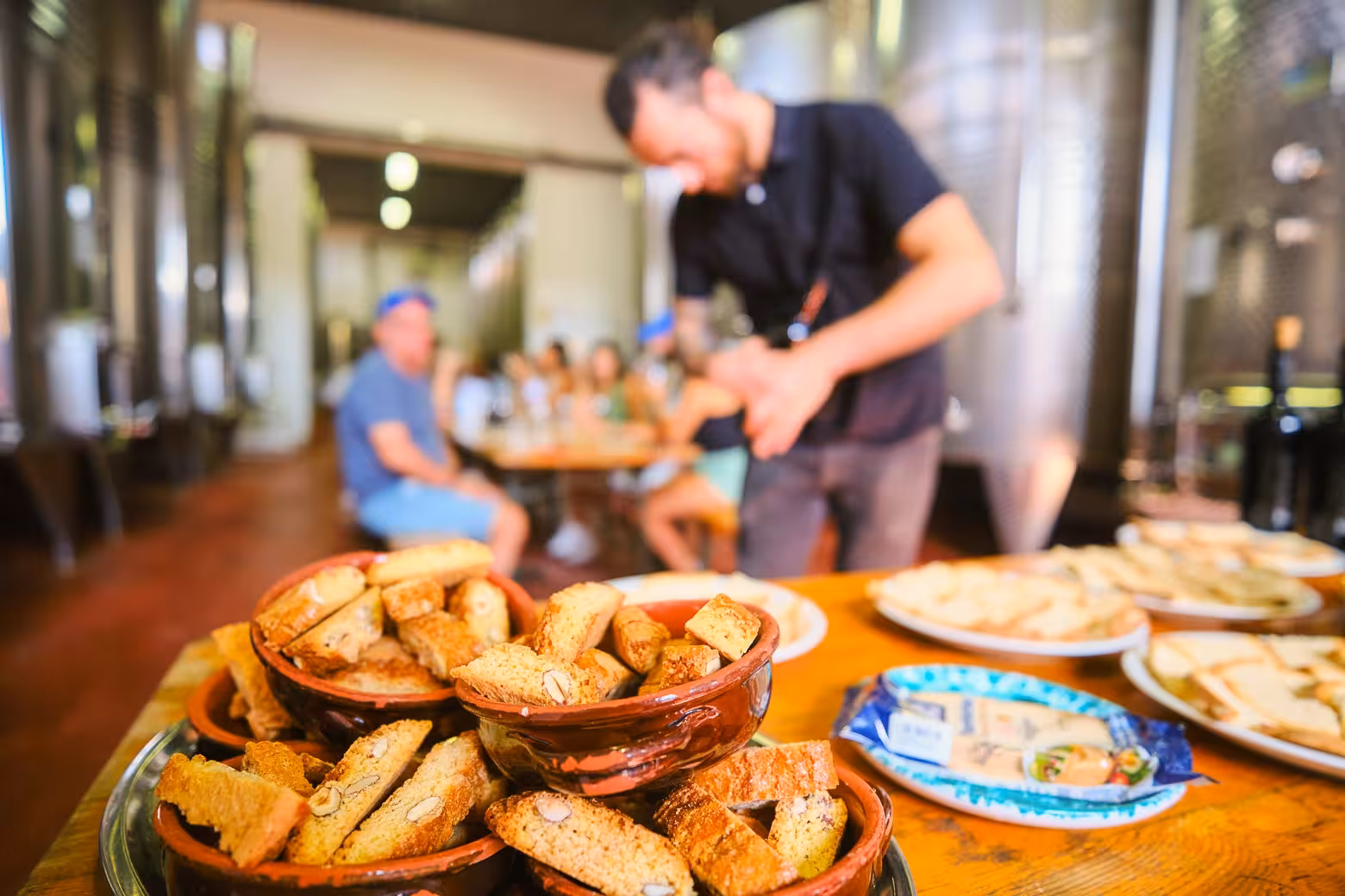 Close-up of biscotti and bread on a table in a Chianti vineyard during a wine tasting experience.