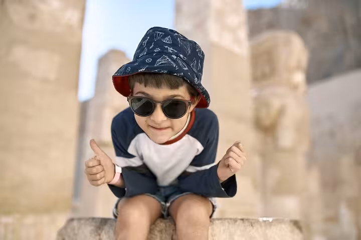 Child tourist at Luxor Temple ruins on 2-day private tour from Hurghada to Luxor and Abu Simbel