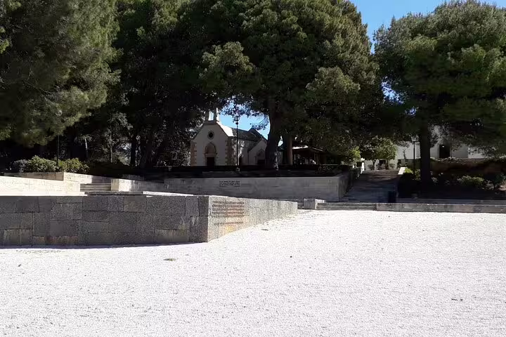 Chrisopigi Monastery surrounded by lush greenery, a serene spot on the Chania Old Town tour.