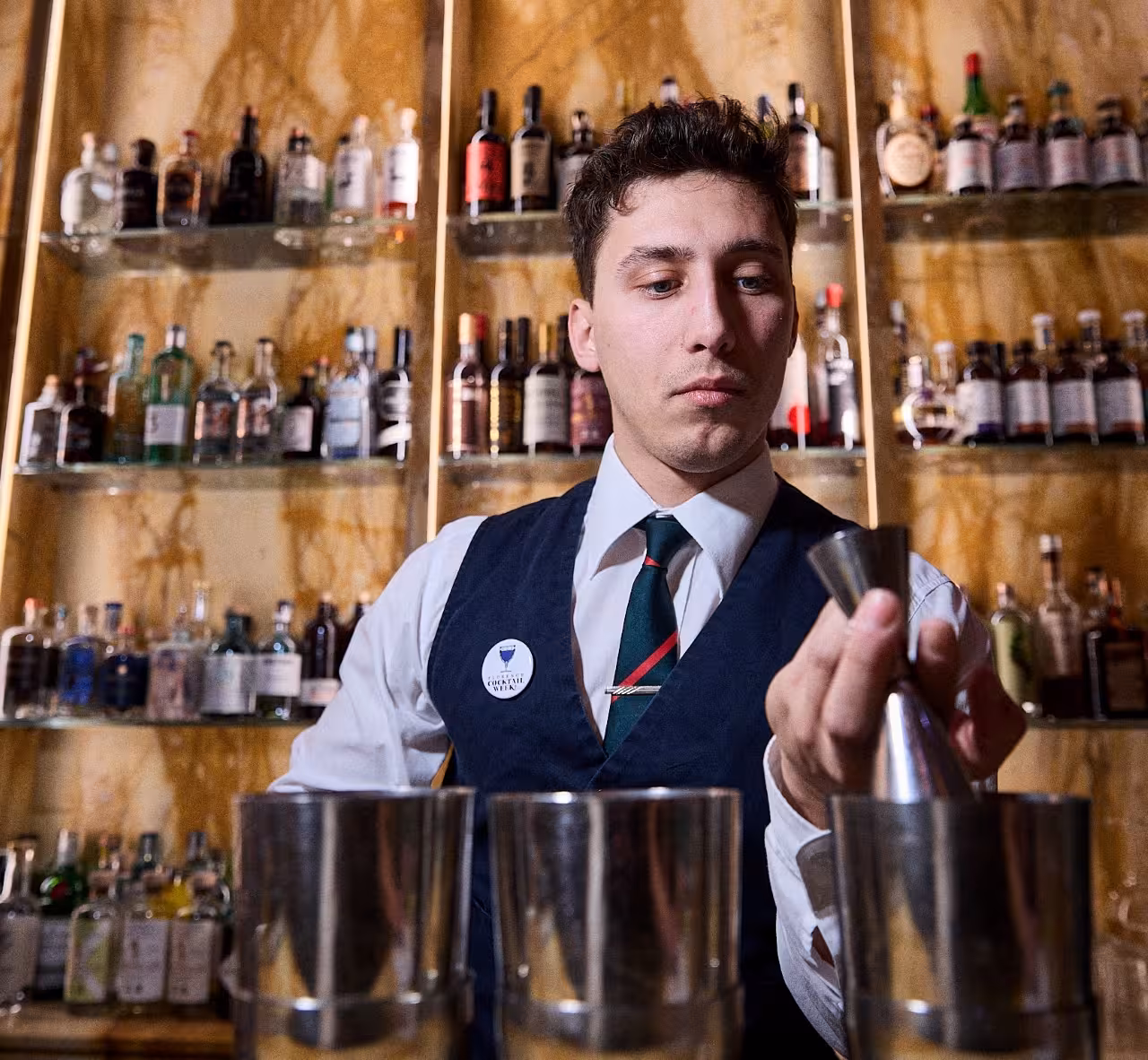 Bartender measuring spirits at Cibrèo Cocktail Bar, Florence, during a culinary experience and cocktail tasting