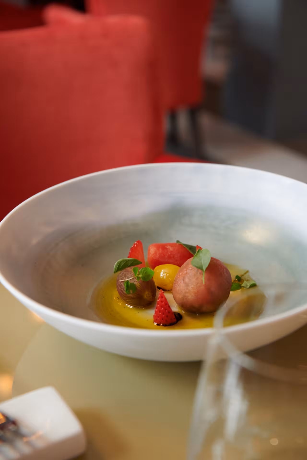 Plated seasonal fruit dessert with basil and olive oil at Cibrèo Ristorante, Florence culinary experience