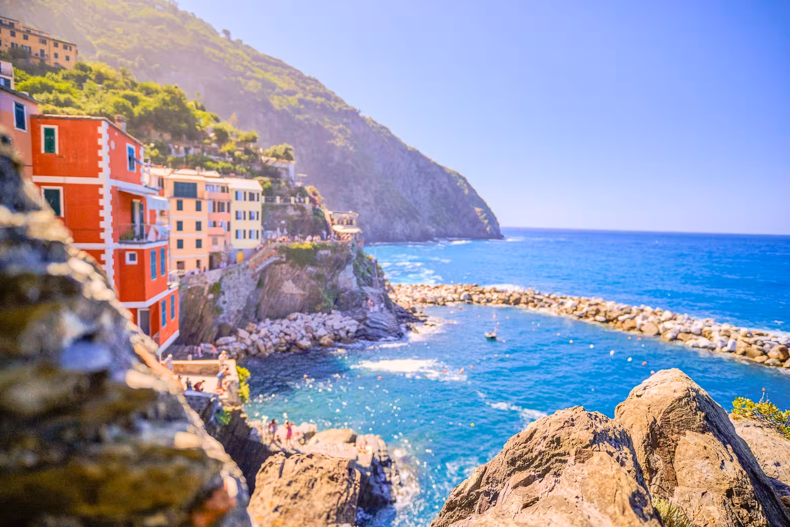 Scenic view of colorful cliffside houses overlooking the vibrant blue sea in Cinque Terre National Park.