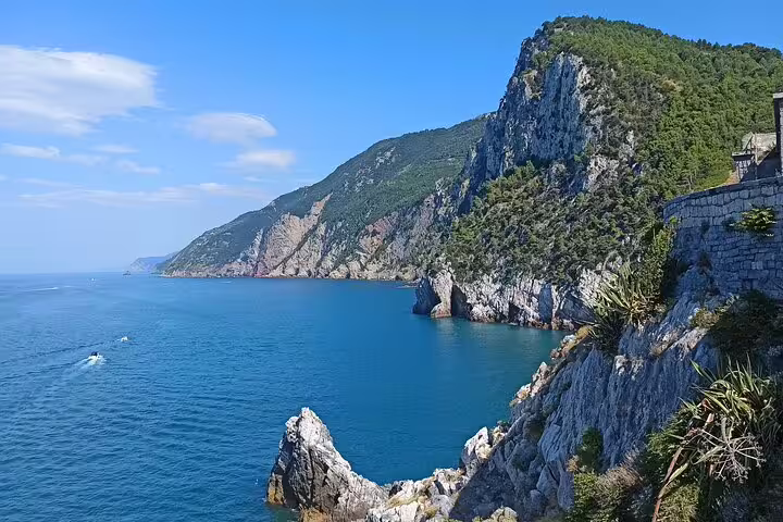 Dramatic Ligurian coastline near La Spezia with turquoise sea and cliffs on a Cinque Terre cruise ship transfer tour