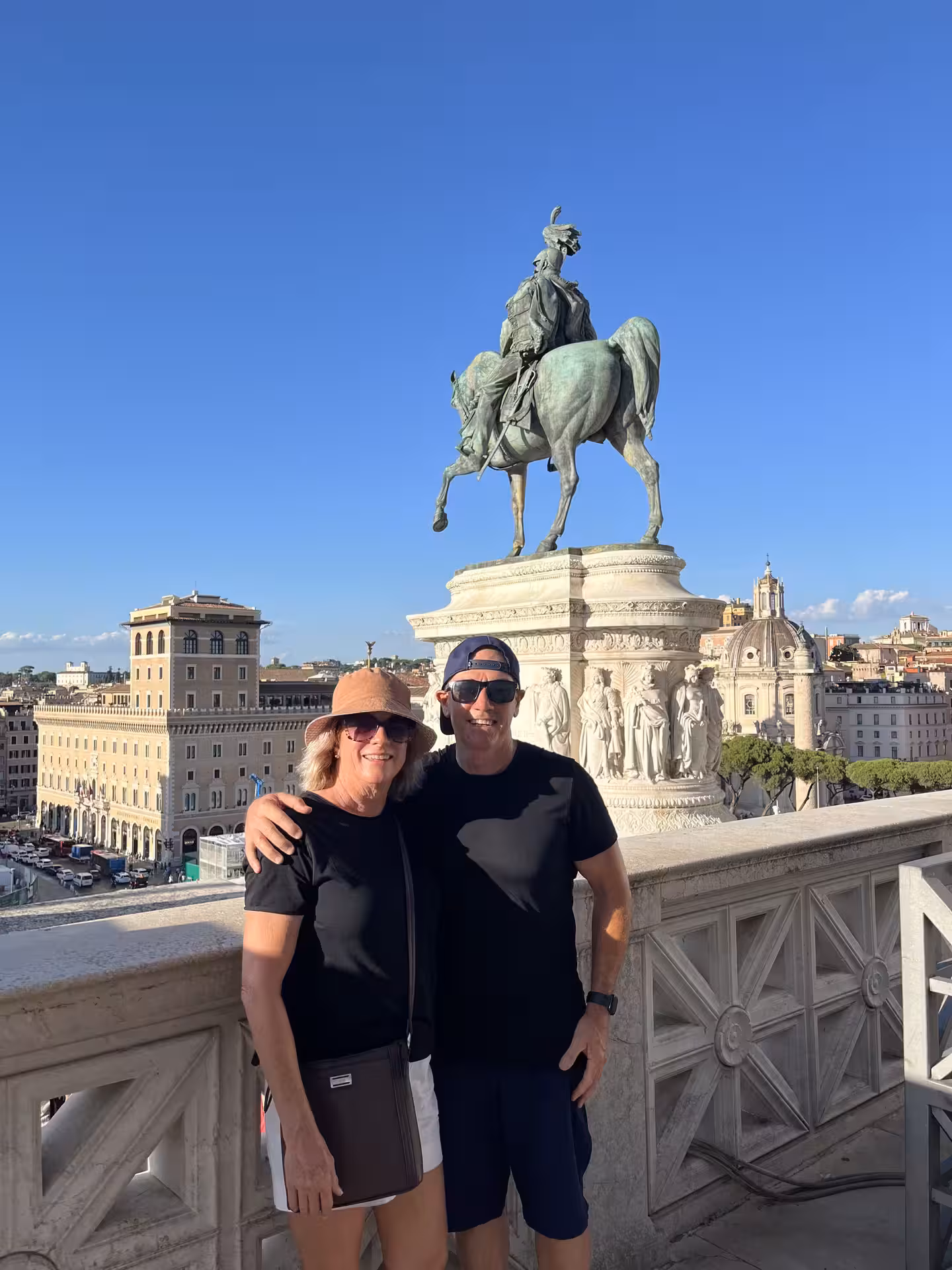 Travelers admire the stunning views from the Altar of the Fatherland, a key attraction on CityWalks in Rome.