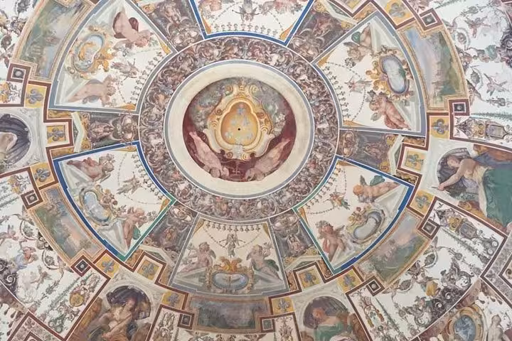 Marvel at the intricate frescoes adorning the ceiling, a highlight of the Civita di Bagnoregio full-day tour experience.