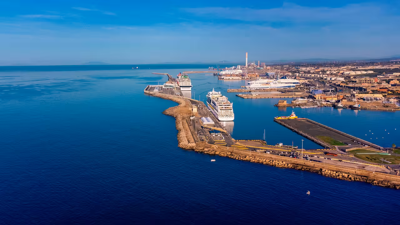 Aerial view of Civitavecchia cruise port terminal with docked ships, showcasing arrival point for private transfer from Rome