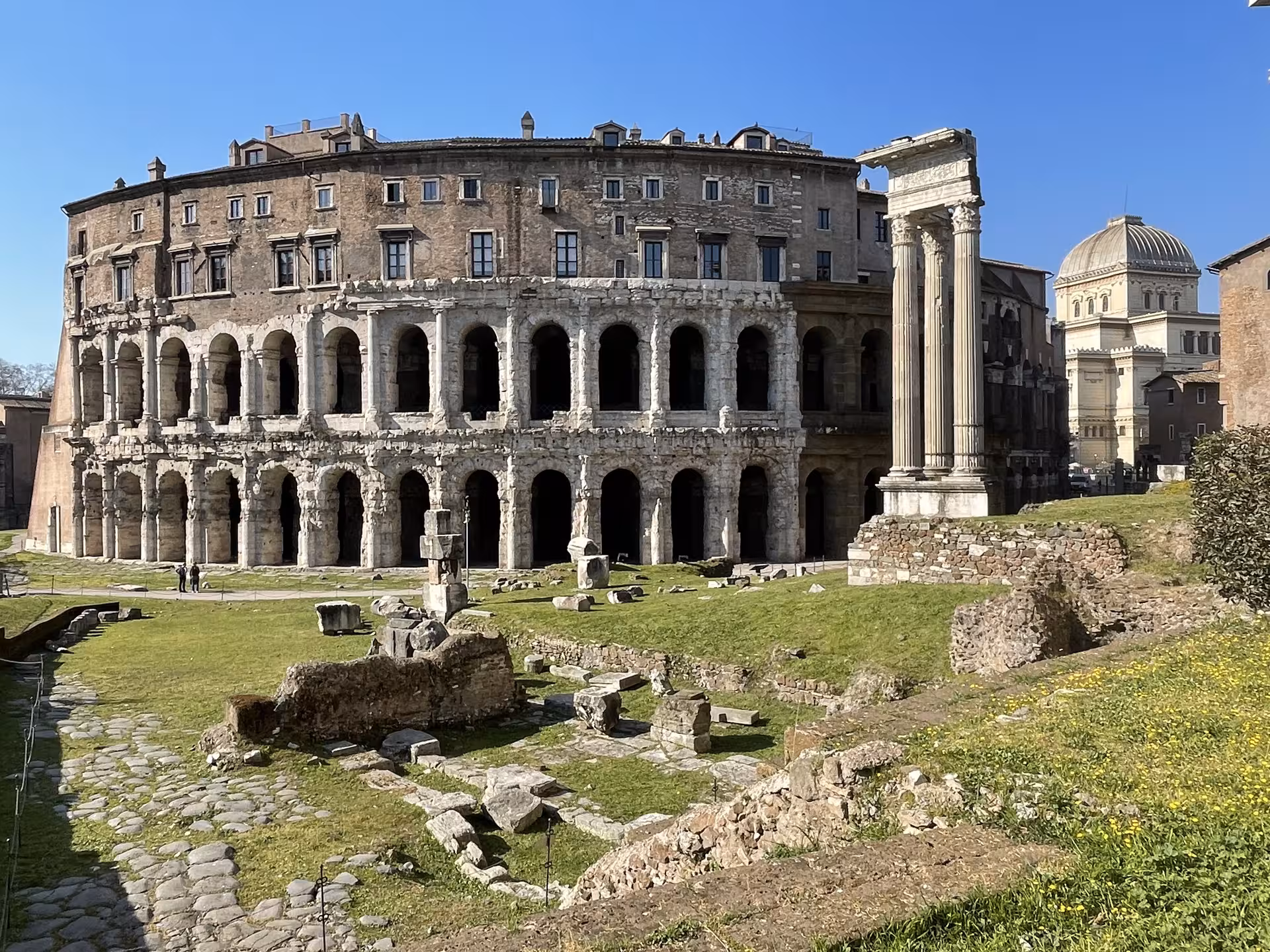 Ancient Roman ruins and arches near the Colosseum visited on a private golf cart tour from Civitavecchia cruise port