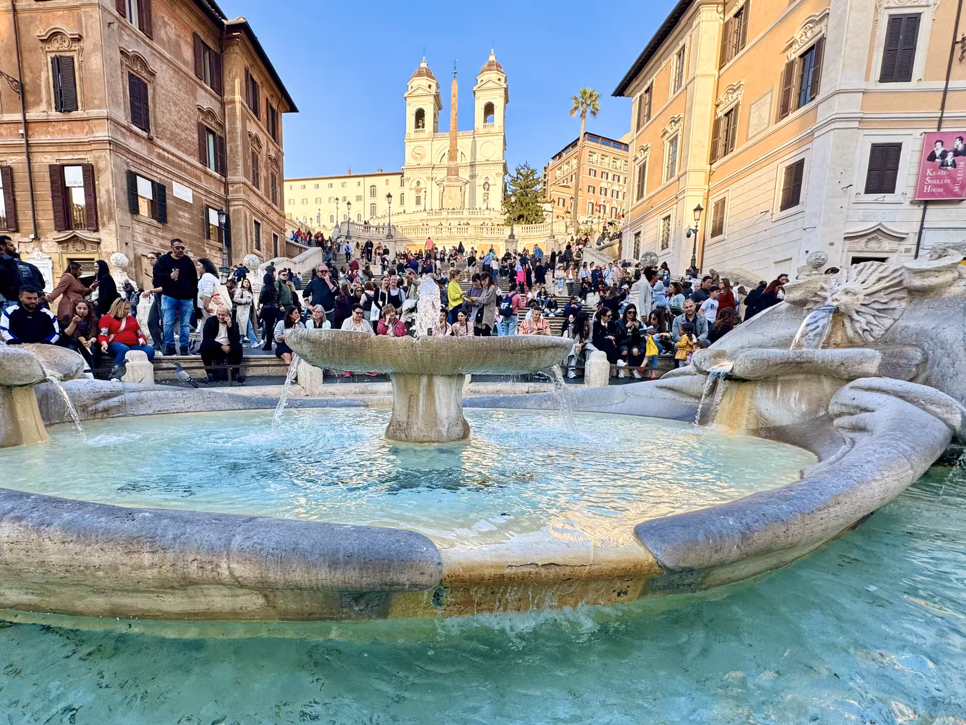 Crowds gather by the Fontana della Barcaccia at the Spanish Steps on a guided Rome city tour from Civitavecchia cruise port