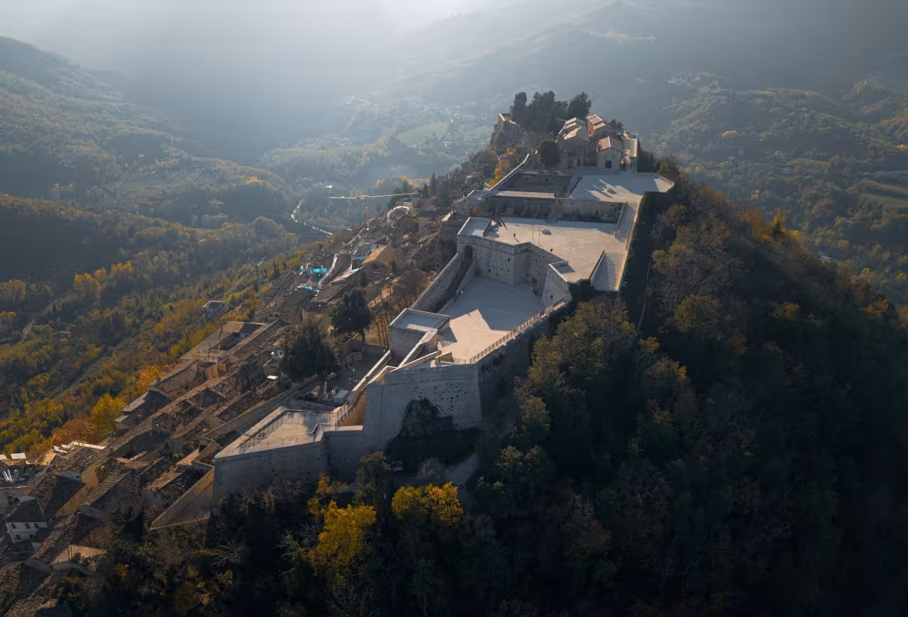 Aerial view of Civitella del Tronto Spanish Fortress overlooking Abruzzo valley, highlight of guided tour