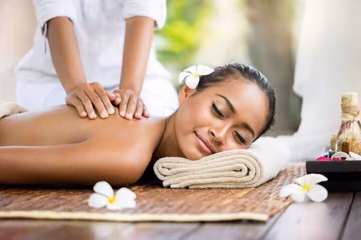 Woman enjoying relaxing back massage at Hurghada Cleopatra Spa Bath, with sauna, steam room and jacuzzi access