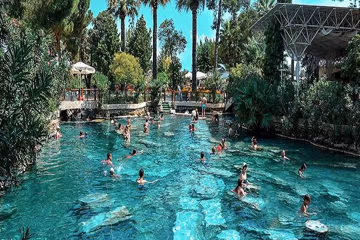 Swimmers in Cleopatra’s Pool at Pamukkale, Turkey, natural thermal spring on Pamukkale tour from Denizli