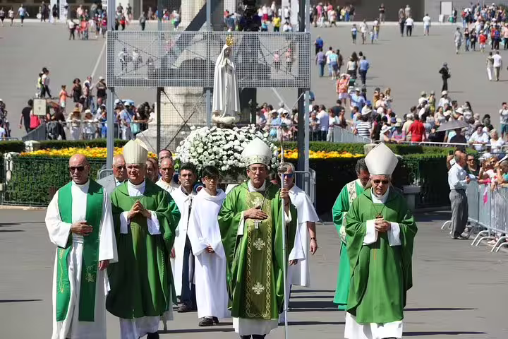 Clergy procession at the Sanctuary of Fatima, highlighting cultural and religious significance on a private tour to Fatima, Nazare, and Obidos.