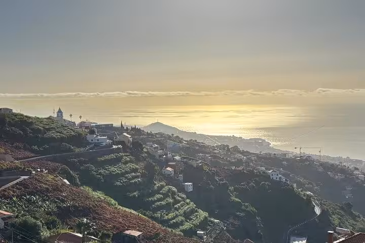 Coastal panorama at sunset from mountain viewpoint on private 4x4 shore excursion, 4-hour island adventure