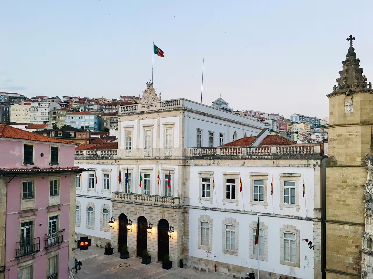 Historic Coimbra cityscape featuring the town hall and colorful buildings, ideal for a private day trip from Lisbon.