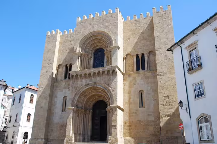 Explore the historic Romanesque architecture of the Old Cathedral in Coimbra on a private tour from Lisbon to Tomar and Coimbra.