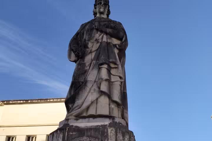 Statue of a historical figure at University of Coimbra, featured in the small group walking tour.