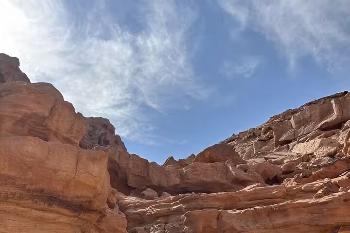 Wide view of Colored Canyon sandstone cliffs under blue sky on Sharm El Sheikh jeep adventure to Blue Hole