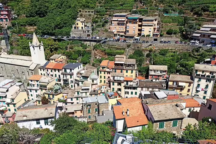 Colorful hillside houses of Riomaggiore seen from above on a guided Cinque Terre private tour in Italy