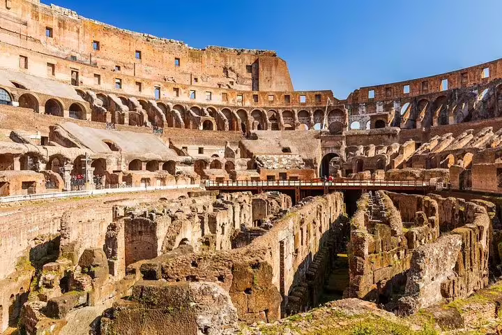 Sunlit view of the Colosseum arena floor and hypogeum ruins visited on an exclusive gladiators guided tour in Rome