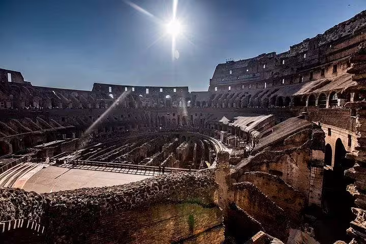 Sunlit view of the Colosseum arena floor and underground chambers on an exclusive gladiators tour in Rome, skip-the-line access