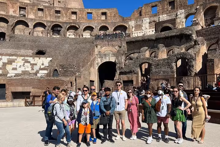Visitors enjoy exclusive arena floor access during a Colosseum tour, capturing the grandeur of ancient Rome.