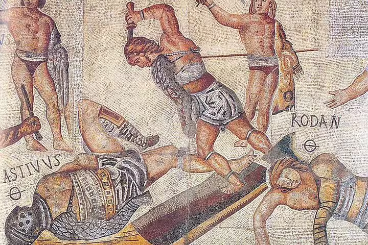 Ancient Roman mosaic of gladiators in combat, inspiring the Exclusive Colosseum Gladiators Arena Floor Guided Tour experience