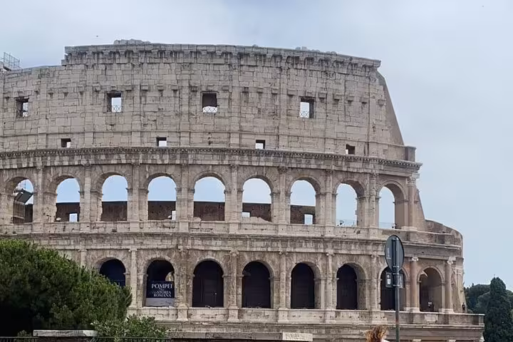 Exterior view of the iconic Colosseum showcasing its grandeur and historical significance in Rome.