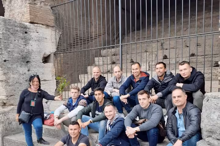 Group enjoying a guided tour inside the historic Colosseum, highlighting immersive experiences in Rome.