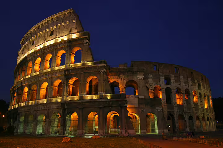 Illuminated Colosseum at night in Rome, iconic landmark featured on a 4-day Eternal City history and culture itinerary