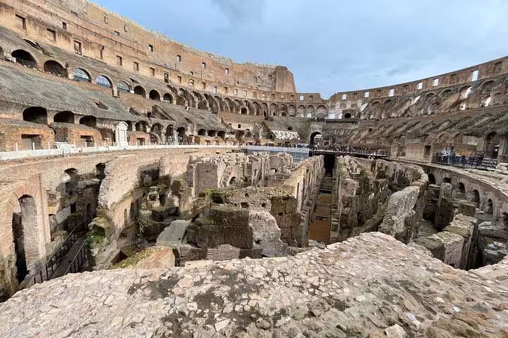 Explore the ancient interior of the Colosseum with an immersive audio guide, showcasing its historical architecture.
