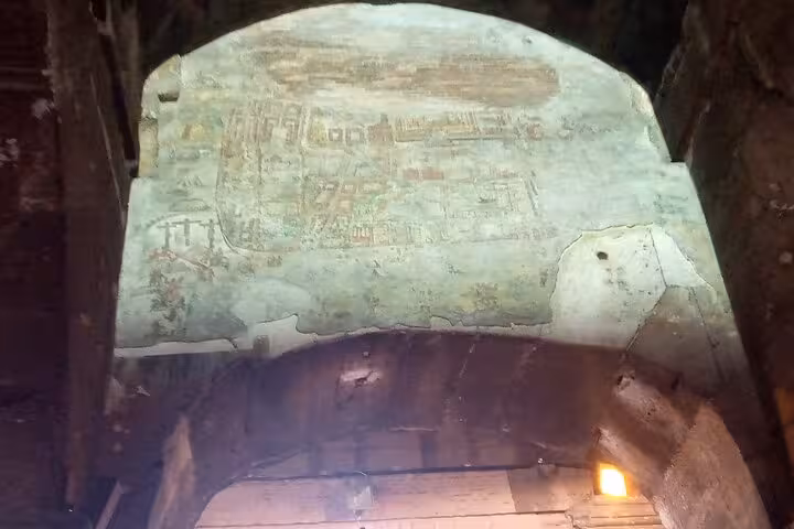 Ancient fresco on a wall inside the underground passages of the Colosseum during the Rome Underground Tour.