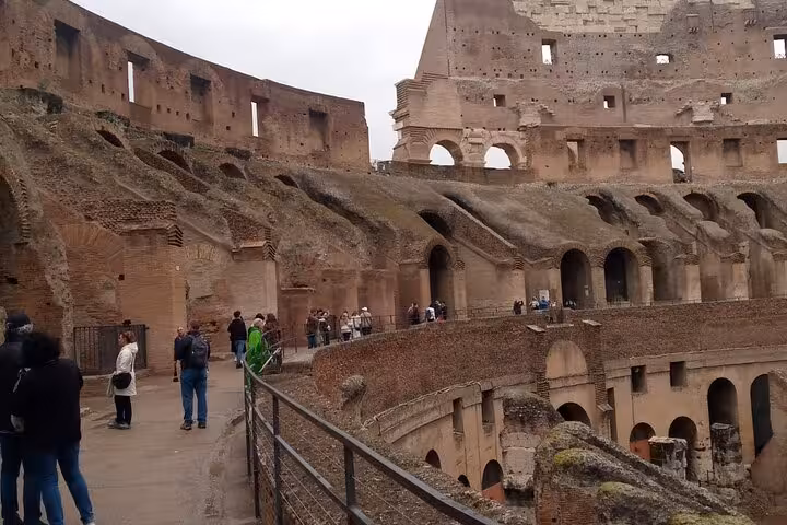 Discover the historic architecture of the Colosseum's inner walls on a guided underground tour in Rome.