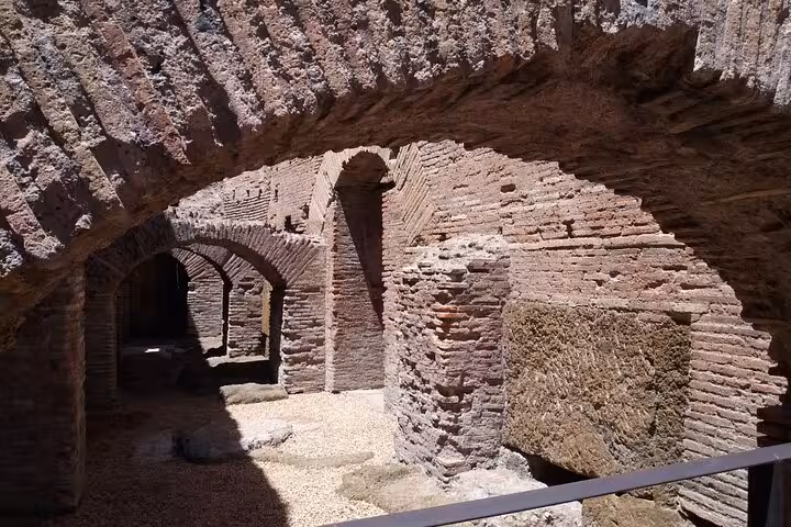 Discover the ancient brick arches and corridors of the Colosseum's underground on a VIP guided tour.