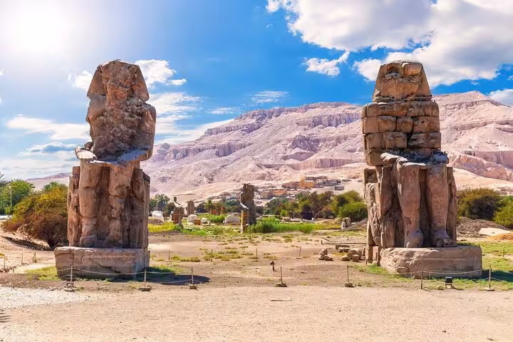 Colossi of Memnon statues in Luxor on a Cairo to Luxor flight tour, small group guided sightseeing in Egypt