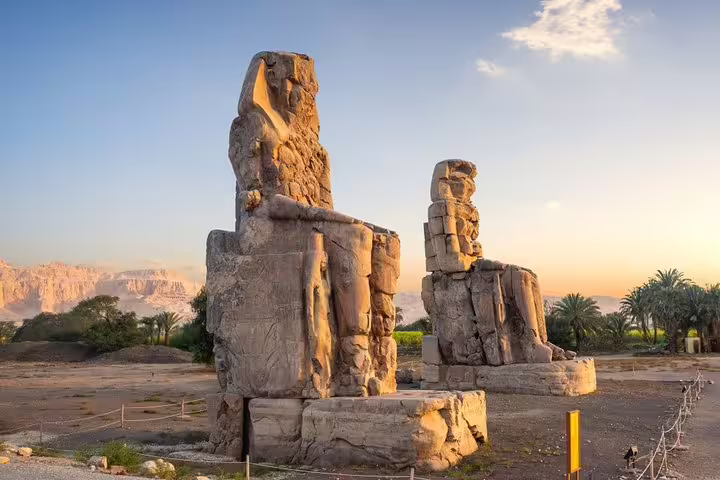 Colossi of Memnon at sunrise in Luxor, iconic West Bank visit on 4 nights 5 days Nile cruise itinerary